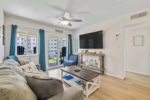 TV, offices - Third-floor condo with pool, hot tub, partial ocean view, gym, & central AC (Fort Morgan)