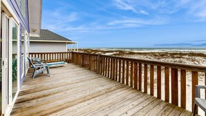 A wooden deck with a view of the beach and ocean. - Centrally-located Gulf front paradise wfurnished sun deck & gorgeous water view (Gulf Shores)