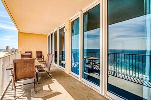 Outdoor dining - Gulf front condo with multiple community pools, a private balcony, & gym (Gulf Shores)