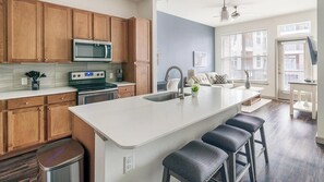 Fridge, dining tables - Landing | Chic 1BD, Gym, Courtyard (Houston)