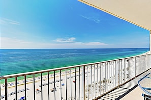 A balcony with a view of the beach and ocean. - Gulfside Condo at The Lighthouse w Pools, Hot Tubs & Direct Beach Access (Gulf Shores)