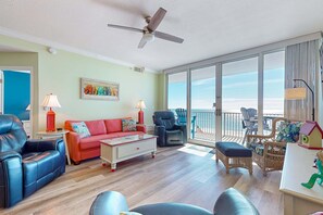 TV, offices - Colorful beachfront condo with Gulf views, pool, sauna, gym & W/D (Gulf Shores)