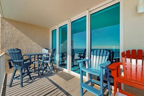 Outdoor dining - Colorful beachfront condo with Gulf views, pool, sauna, gym & W/D (Gulf Shores)
