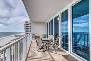 Outdoor dining - Beachfront condo with amazing views, balcony, pools, hot tubs & fitness center (Gulf Shores)