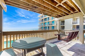 Outdoor dining - Ocean-view condo with pool access, outdoor seating, central AC & WiFi (Gulf Shores)