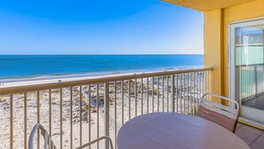 A balcony with a view of the beach and ocean. - Beachfront Condo with Shared Outdoor Pool, Central AC, Private Balcony, Views, WiFi (Gulf Shores)