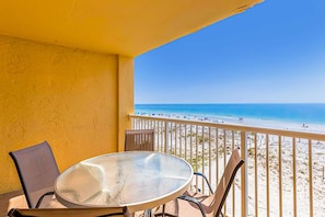 Outdoor dining - 3rd-floor beachfront condo with private balcony, AC, hot tub, pool, sauna (Gulf Shores)