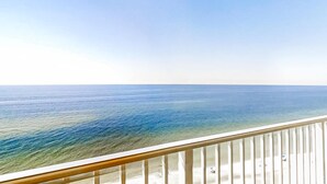 A balcony with a view of the ocean. - Beachfront 5th-floor condo with balcony, AC, pool, hot tub & view (Gulf Shores)