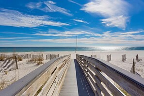 A wooden boardwalk leading to a beach with a clear sky. - Gulf-Front Condo with Shared Outdoor Pool, Private Balcony, Great Views, Central AC (Gulf Shores)