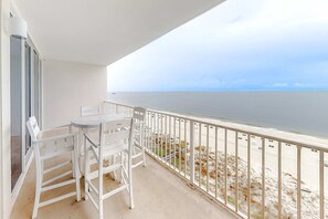 Outdoor dining - Polished, Gulf-Front Condo w/ Balcony, AC, WiFi & Shared Pools/Hot Tubs/Sauna (Gulf Shores)
