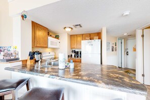 Fridge, microwave, oven, stovetop - Colorful condo in beachfront complex with pools, gym, central AC & beach access (Gulf Shores)