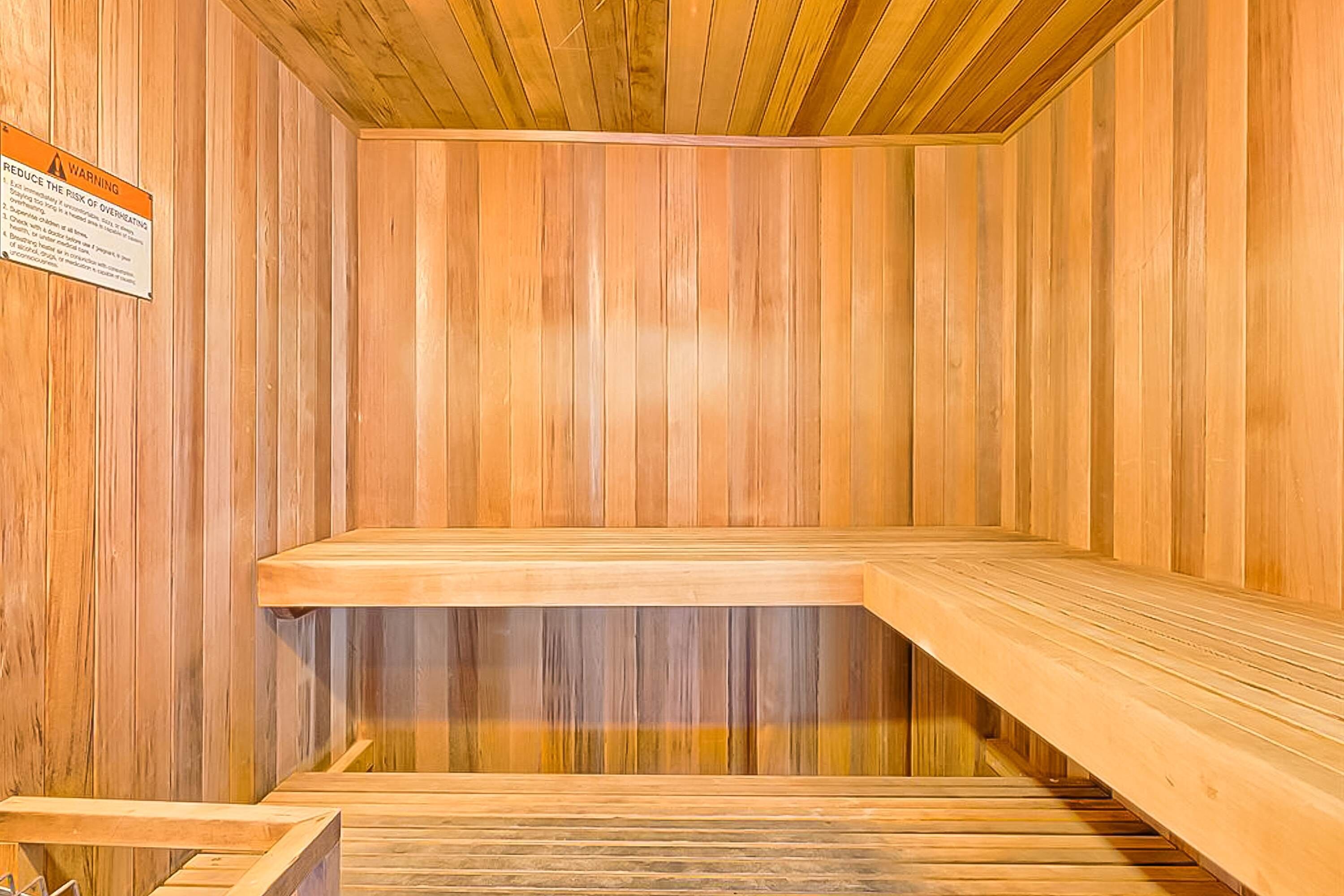 A sauna with wooden walls and benches.