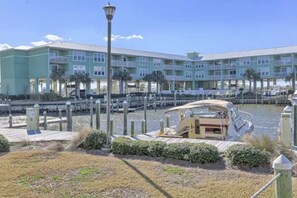Exterior - Waterfront condo with bay views, pool, hot tub, boat ramp, & private balcony (Gulf Shores)