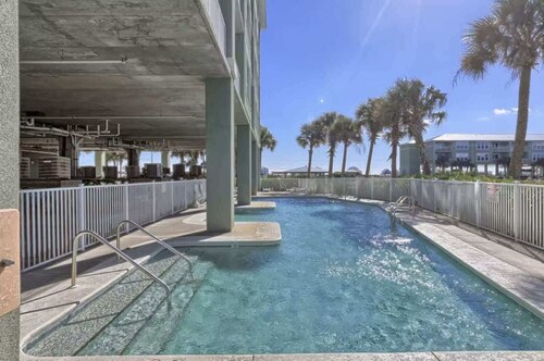 Waterfront condo with bay views, pool, hot tub, boat ramp, & private balcony