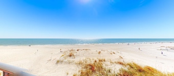 Beachfront condo with balcony, pool, BBQ area, central AC, free WiFi, views