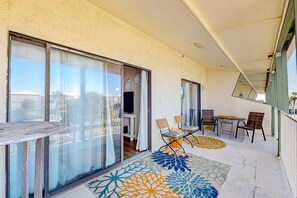 Outdoor dining - Spacious & sun-filled Gulfside condo with pool, balcony, AC, & lovely views (Gulf Shores)