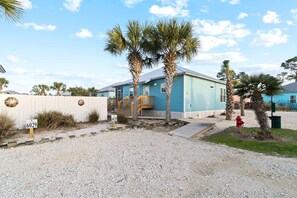 Exterior - Brand-new cottage with covered patio, central AC, W&D, & pool access - near beach (Gulf Shores)
