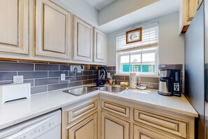 Fridge, microwave, oven, stovetop - Modern waterfront condo with balcony & outdoor pool - beach across the street (Gulf Shores)