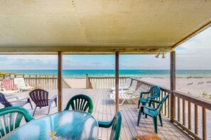 Outdoor dining - Sunny oceanfront home with beach access, balcony, washer/dryer, & WiFi (Gulf Shores)