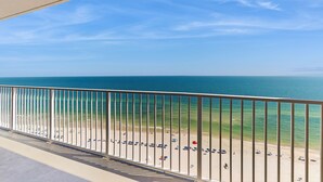 A balcony with a view of the beach and ocean. - Gulf front beach condo with multiple community pools & sauna (Gulf Shores)