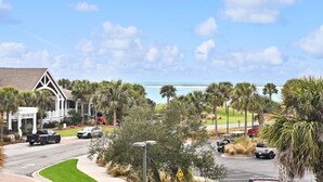 A coastal road with a church, parked cars, and a view of the beach. - Seabrook Exclusives | 2942 Atrium (Seabrook Island)