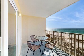 Outdoor dining - Gulf-front 3rd-floor condo with outdoor pool, central AC, & balcony (Gulf Shores)