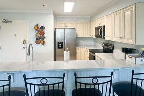 Fridge, microwave, oven, stovetop - Waterfront condo w balcony, boat slip, shared hot tubs, pools (Gulf Shores)
