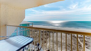 A balcony with a view of the beach and ocean. - Beach/Gulf-front condo with water views, on-site pool, & private balcony (Gulf Shores)
