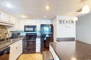 Fridge, microwave, oven, stovetop - Gulf front condo with stunning Gulf views, outdoor pool & beach access (Gulf Shores)