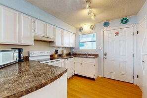 Fridge, microwave, oven, stovetop - Waterfront condo with a furnished balcony, peek-a-boo Gulf views, & shared pools (Gulf Shores)