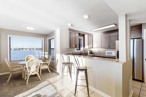 Fridge, microwave, oven, stovetop - Lagoon-front, 3rd-floor condo with balcony, AC, & outdoor pool (Gulf Shores)