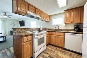 Fridge, microwave, oven, stovetop - Oceanfront condo with pool, grilling area, alfresco dining, internet, W/D, & AC (Gulf Shores)
