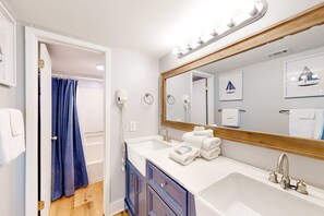 Shower, hair dryer, towels - Inviting condo with ocean view, on-site pool, cozy balcony, washer/dryer & AC (Gulf Shores)