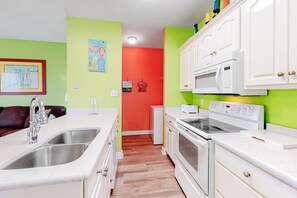 Fridge, microwave, oven, stovetop - Colorful Duplex Apartment with Porch, WiFi & Central AC - Walk to the Beach (Gulf Shores)