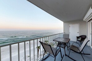 Outdoor dining - Renovated Gulf-front condo with lovely view, balcony, AC, W&D & pool (Gulf Shores)