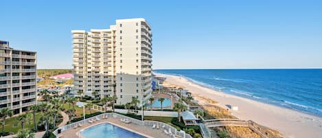 A resort with a pool, beachfront, and high-rise buildings.