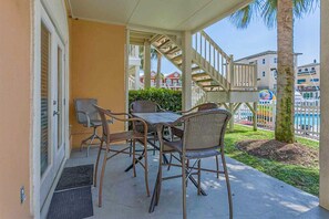Outdoor dining - Colorful Ground-Floor Condo w/Shared Pool, Central A/C, Private W/D, Free WiFi (Orange Beach)