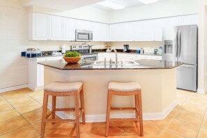 Fridge, microwave, oven, stovetop - Bold & Bright Beachfront Condo with Resort Style Pools, Sauna, Fitness Room, Private Balcony featuring amazing Views! (Orange Beach)