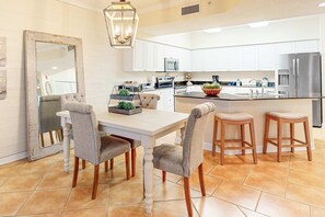 Dining - Bold & Bright Beachfront Condo with Resort Style Pools, Sauna, Fitness Room, Private Balcony featuring amazing Views! (Orange Beach)