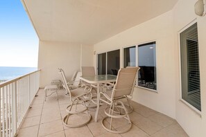 Outdoor dining - Bold & Bright Beachfront Condo with Resort Style Pools, Sauna, Fitness Room, Private Balcony featuring amazing Views! (Orange Beach)