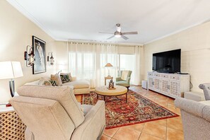 TV, offices - Bold & Bright Beachfront Condo with Resort Style Pools, Sauna, Fitness Room, Private Balcony featuring amazing Views! (Orange Beach)