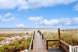 A wooden boardwalk leading to a beach with a clear sky. - Gulf & Beachfront Condo wBalcony, Central AC, Shared Hot Tub, Pools, Free WiFi (Orange Beach)