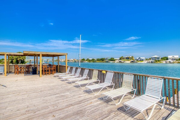 Terrace/patio - Riverside condo with pool, covered balcony, & easy beach access (Orange Beach)