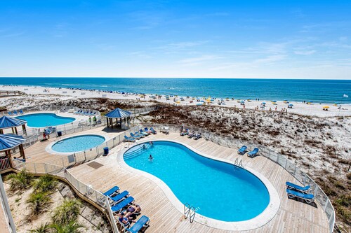Two-story, Gulf-front condo with a pool, WiFi, washer/dryer, & central A/C