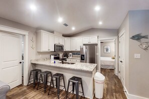 Fridge, microwave, oven, stovetop - Inviting home near the beach with balcony, full kitchen, central AC, & W/D (Dauphin Island)