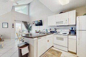 Fridge, microwave, oven, stovetop - Cozy coastal condo with loft & shared pool and beach access (Orange Beach)