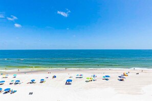 A beach with white sand and clear blue water. - Gulf-front 6th-floor condo with balcony, pool, hot tub, & sauna - beach access (Orange Beach)