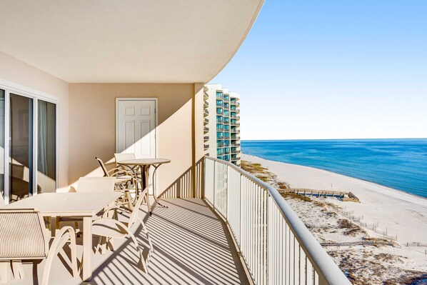 Outdoor dining - Gulf-front condo with balcony, central AC, pools, hot tubs & beach access (Orange Beach)