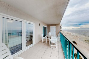 Outdoor dining - Gulf-front condo with central AC, balcony & pool (Gulf Shores)