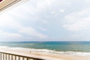A beach view with a balcony overlooking the ocean. - 8th-floor beachfront condo with Gulf view, waterfront pool, & balcony (Gulf Shores)